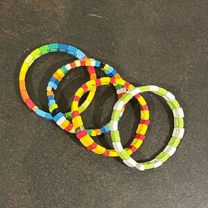 group of 4 Roxanne Assoulin bracelets